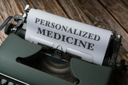 a typewriter with a paper that reads personalized medicine